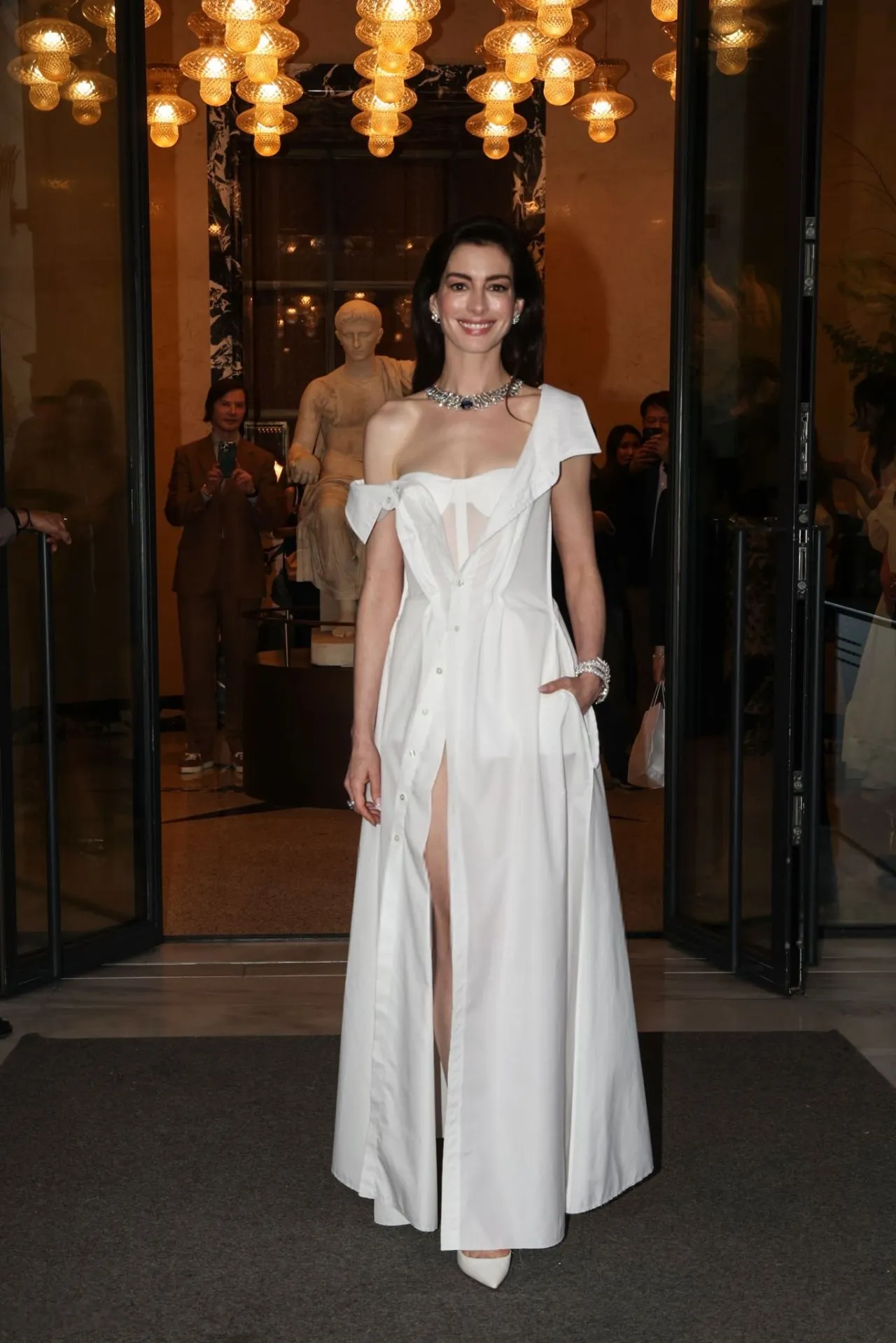 ANNE HATHAWAY IN WHITE DRESS AT THE BULGARI HOTEL IN ROME6